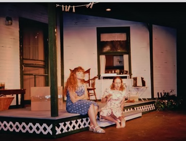 Elizabeth and Hattie, gossiping on the front porch. Look up and you'll see the laundry line!